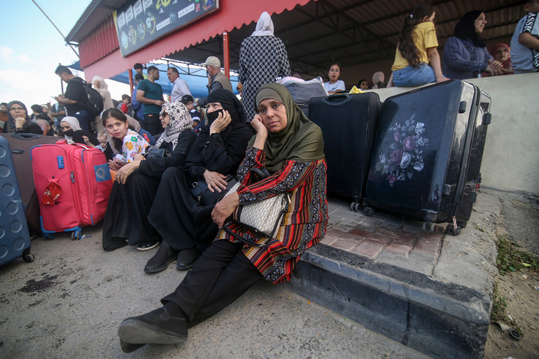 Palestinians waiting to cross the Rafah Border Gate