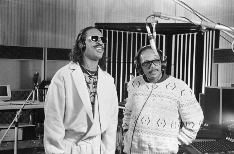 Stevie Wonder and Quincy Jones in a recording studio.