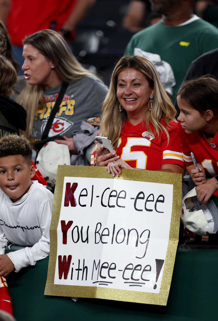 A Kansas City Chiefs fan holds up a sign that reads, "Kel-cee-eee You Belong With Mee-eee!" prior to the game between the Kansas City Chiefs and the New York Jets at MetLife Stadium in East Rutherford, N.J.