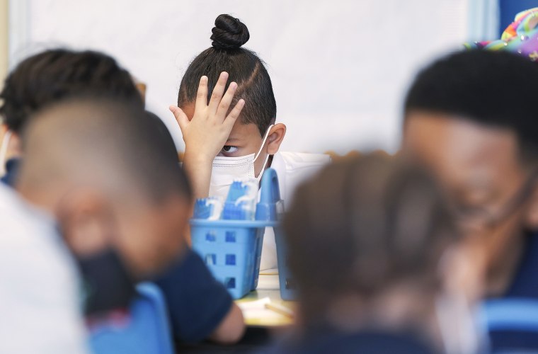 A first grader pauses during an assignment at Burrus Elementary in Houston