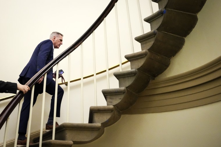 Kevin McCarthy ascends a staircase in the Capitol