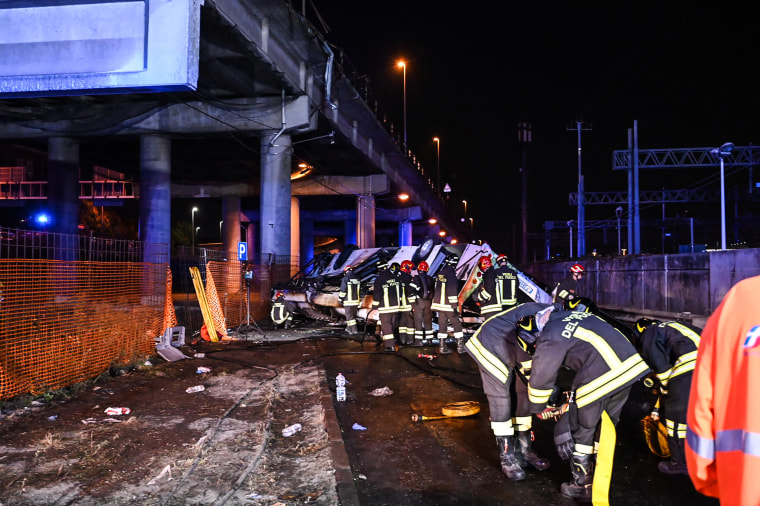 Image: Firefighters work on the site of a bus accident in Mestre, near Venice,