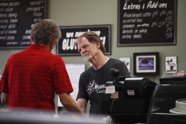 Baker Jack Phillips manages his shop in Lakewood, Colo.