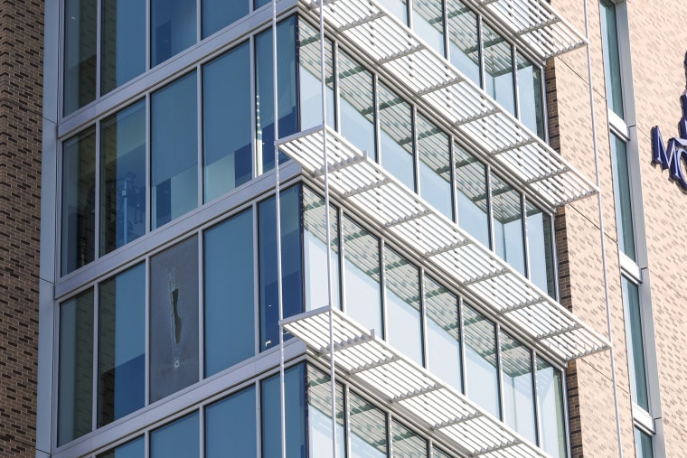 A bullet-shattered window of a dorm room at Thurgood Marshall Hall at Morgan State University