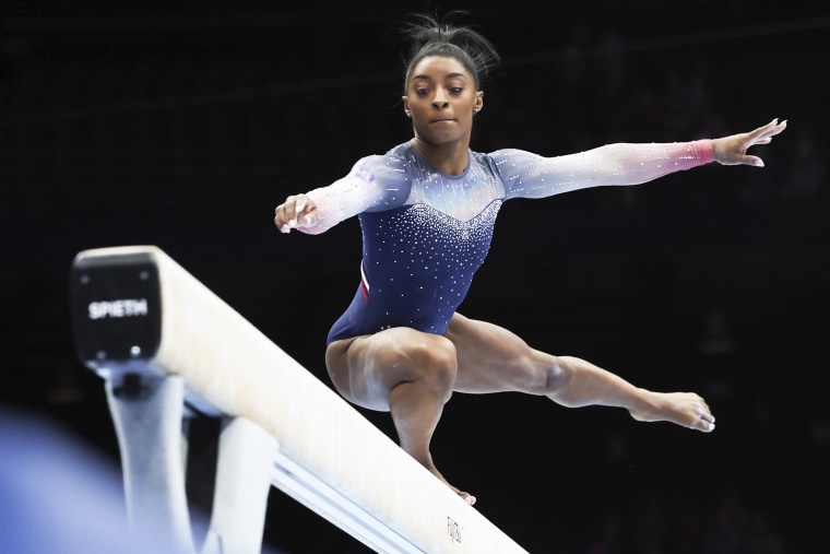 Simone Biles balances on a beam during the Artistic Gymnastics World Championships