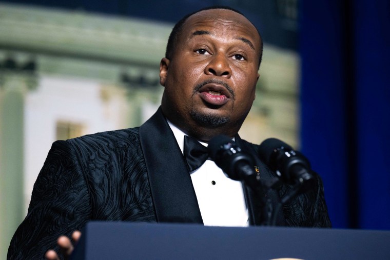 Roy Wood Jr. speaks at a podium