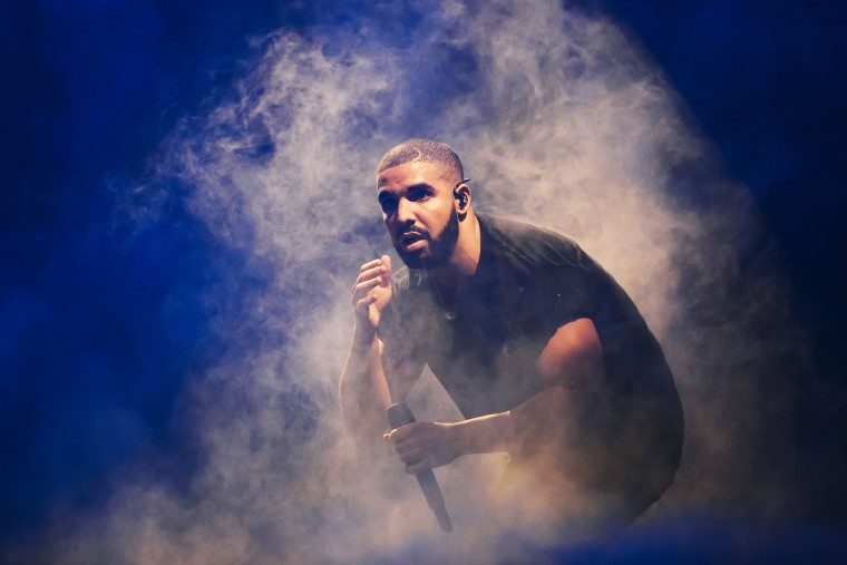 Drake performs on stage.
