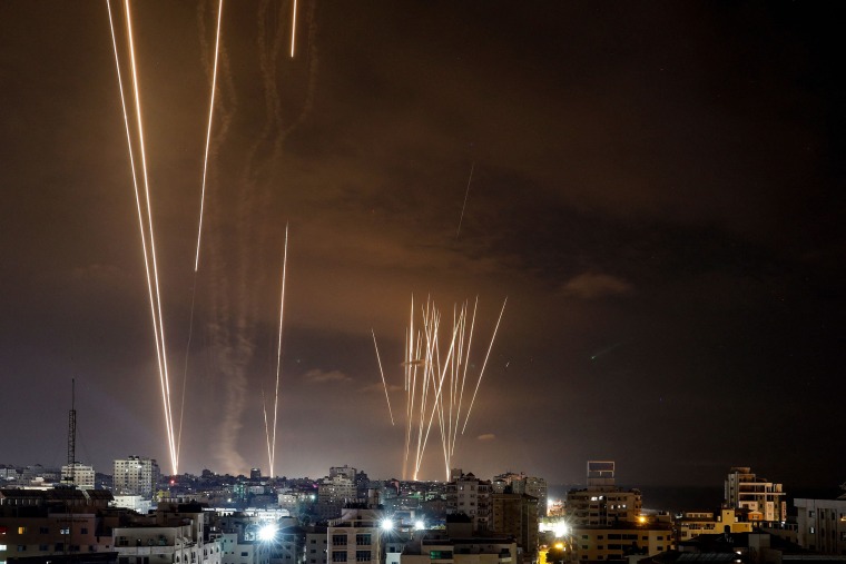 Launched rockets illuminate the dark sky in Gaza City