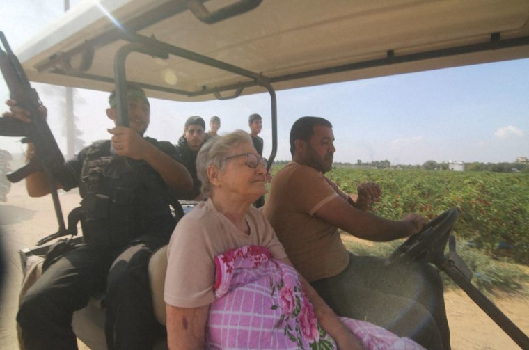 Palestinians transporting Yaffa Adar from Kfar Azza kibbutz into the Gaza Strip.