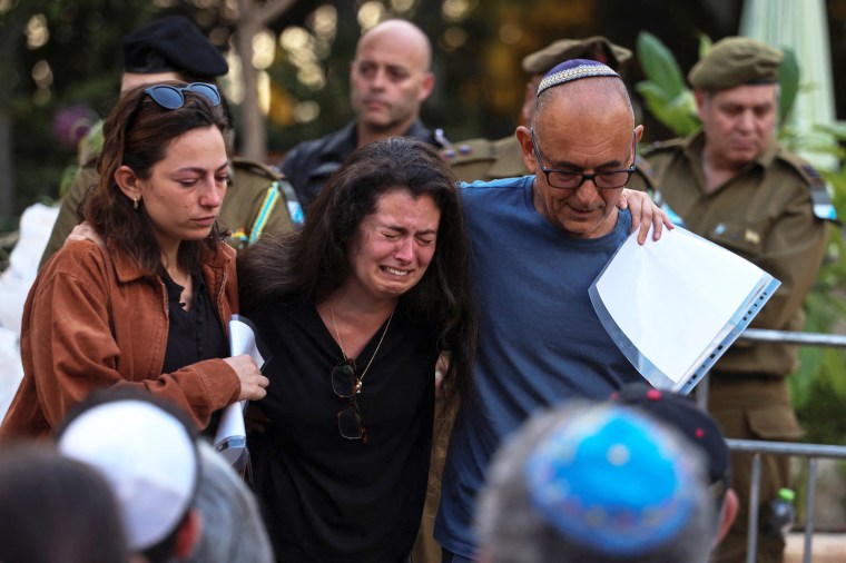 People mourn Ili Bar Sade, a soldier who was killed in an attack by Hamas militants, at his funeral in Tel Aviv