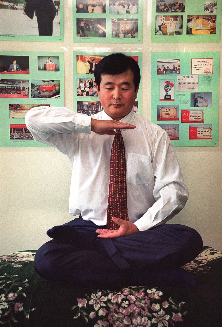 Li Hongzhi poses during an interview 