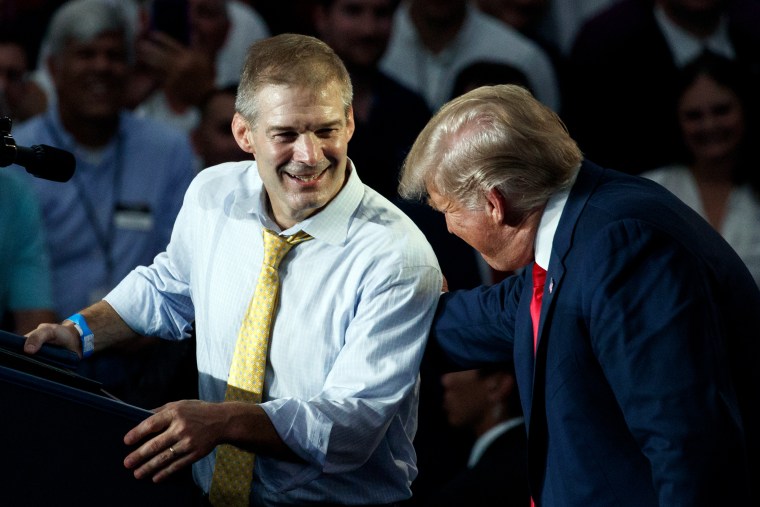 Rep. Jim Jordan, R-Ohio, looks to President Donald Trump as he speaks at a rally