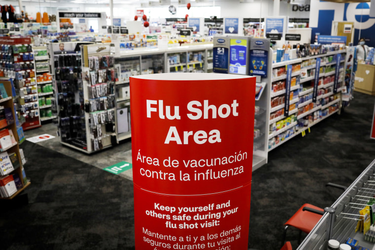 A sign identifies the flu shot area of a CVS pharmacy in Miami