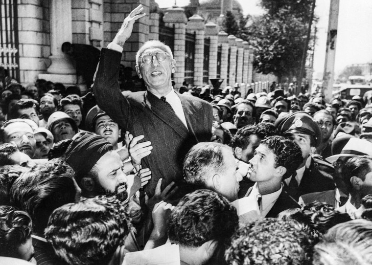 Image: Prime Minister Mohammad Mossadegh rides on the shoulders of cheering crowds
