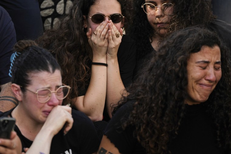 Mourners react during the funeral of Danielle Waldmann and her partner Noam Shai, killed in a Hamas attack, in the northern Israeli town of Kiryat Tivon, Thursday, Oct. 12, 2023.