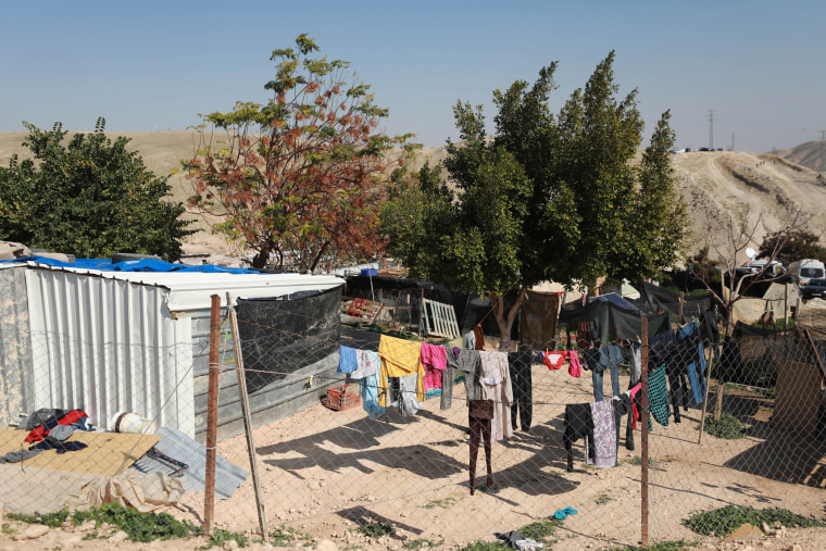 Clothes hang on a laundry line in the village of Khan al-Ahmar