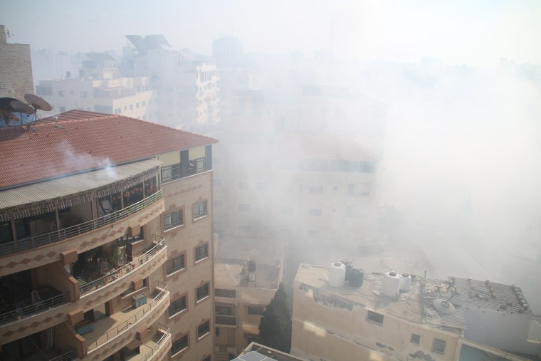 Smoke fills the air after Israeli aircraft bombed the area west of Gaza City on Oct. 11, 2023.