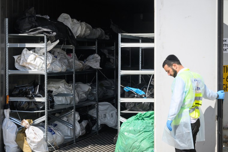 A refrigerated container holding the bodies of Israeli citizens killed during the recent attacks by Hamas is opened during a tour of the facility on Oc. 13, 2023 in Ramla, Israel. 