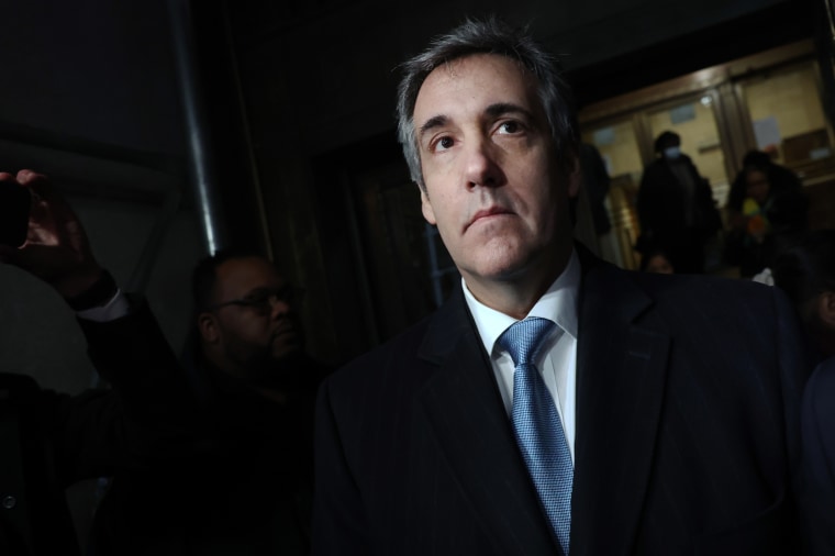 Michael Cohen walks out of a Manhattan courthouse