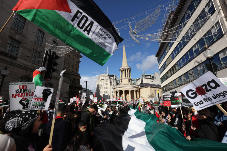 People gather for the "March For Palestine" protest in London