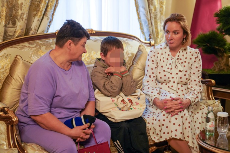 A 7-year-old Ukrainian boy, sitting next to his grandmother and Russia's commissioner for children's rights, Maria Lvova-Belova, was released to Qatari diplomats in Moscow on Friday. 