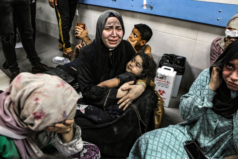 Wounded Palestinians lay at the al-Shifa hospital in Gaza City, central Gaza Strip, Tuesday, Oct. 17, 2023.