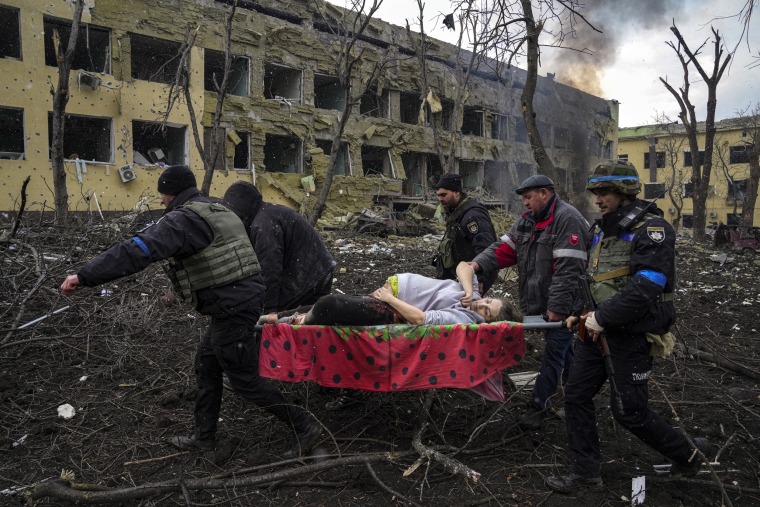 Image: First responders evacuate an injured pregnant woman, Iryna Kalinina, from a Mariupol maternity hospital that was damaged by a Russian airstrike in Ukraine on March 9, 2022. The woman and her baby later died.