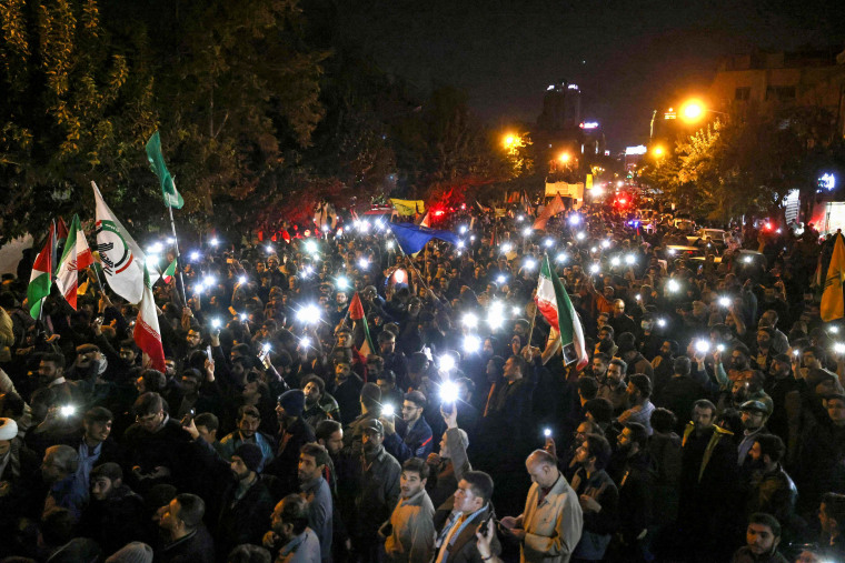 People protest in support of Palestinians in front of the English embassy in Tehran.