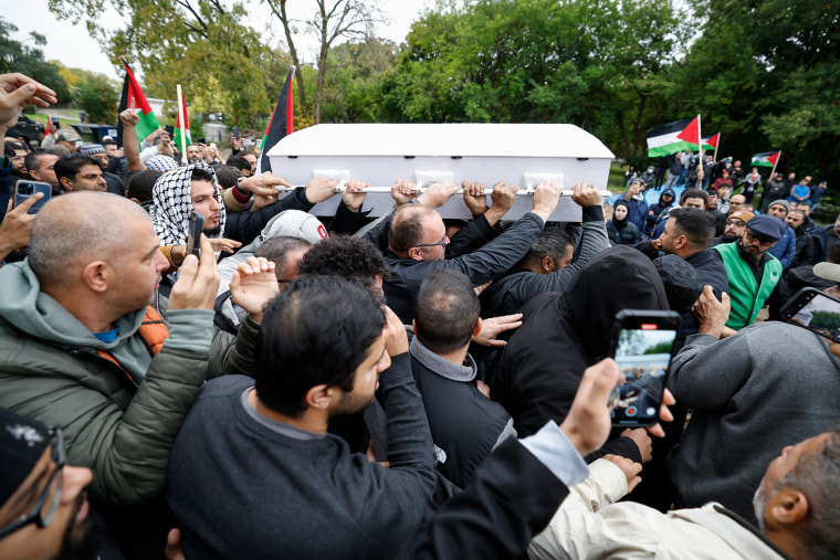 Mourners carry the coffin Wadea Al-Fayoume during his funeral