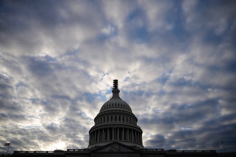 Clouds form over the Capitol.