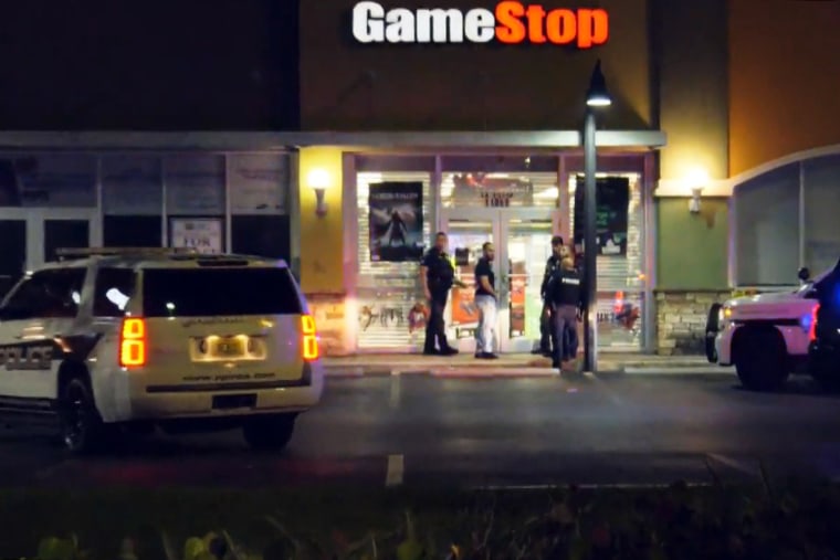 Police respond to the scene at GameStop.