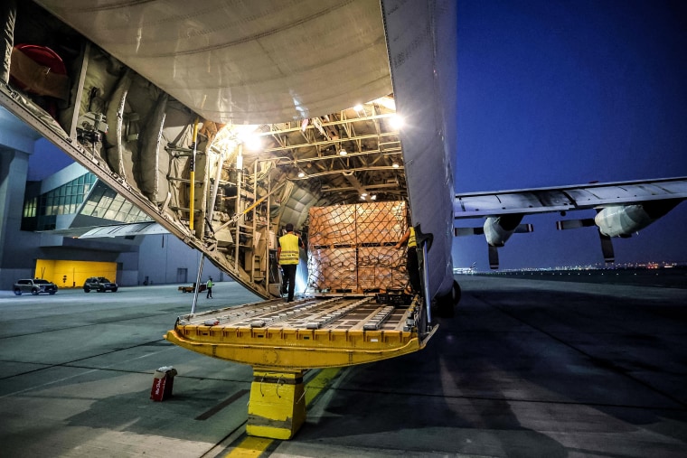 Image: Humanitarian aid provided by the United Nations is loaded onto a plane