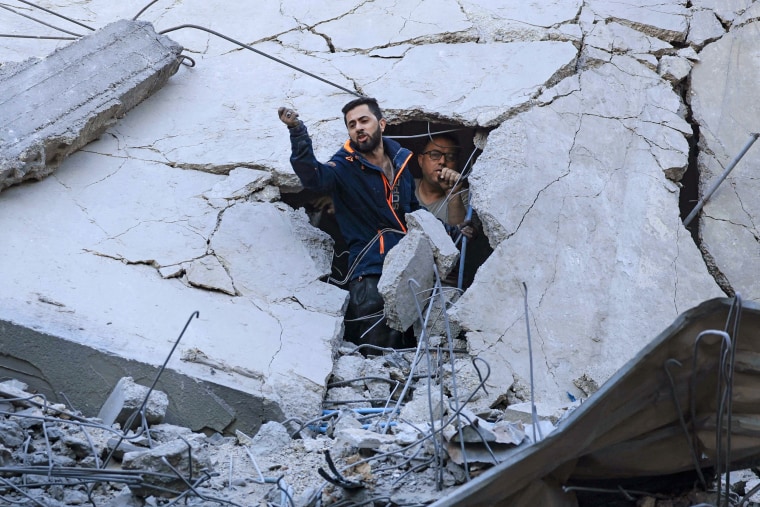 Members of the Palestinian civil defense look for survivors in the rubble of a building hit during Israeli bombardment in Khan Yunis on the southern Gaza Strip on October 19, 2023.
