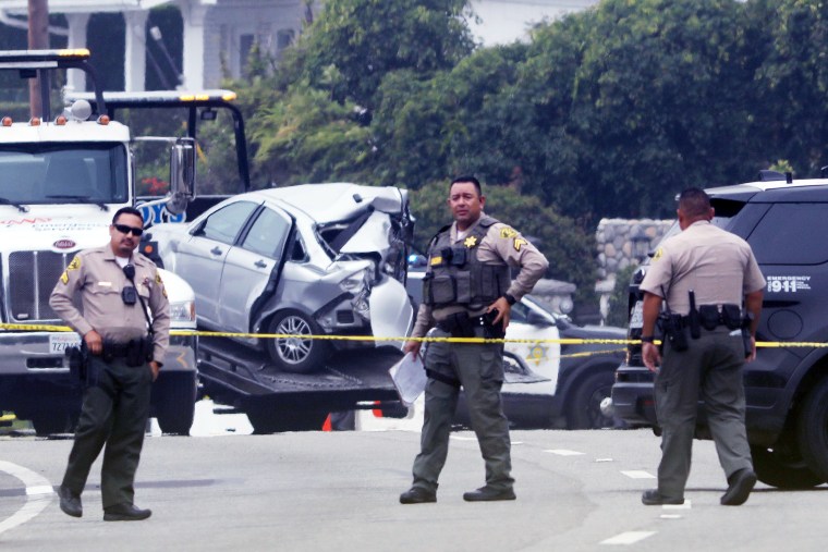 Sheriff deputies monitor the scene where four women were killed in a multi-vehicle crash in Malibu on Oct. 18, 2023.