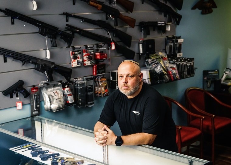 David Kowalsky, 48, owner of Florida Gun Store, stands for a portrait in his shop in Hollywood, Fla.