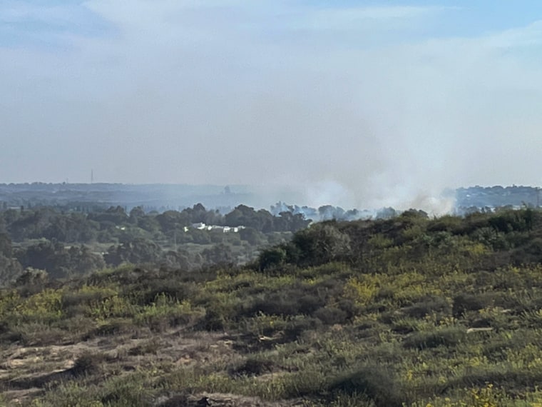 On a hill near Zikim, an Israeli community 3 miles from the Gaza Border, smoke rises from a wooded area where a missile landed a mile or so away. A little further away is Gaza, where smoke rises from the ongoing bombardment and distant booms can be heard and even felt.