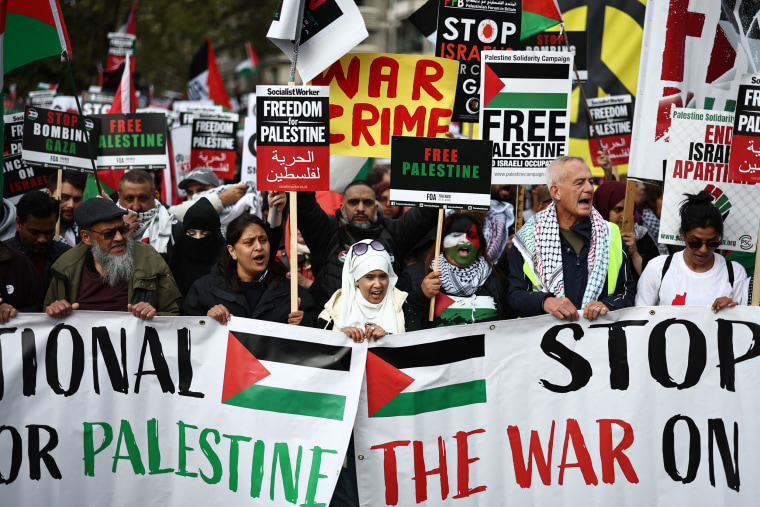 Demonstrators take part in a "March For Palestine" in London on Oct. 21, 2023. 
