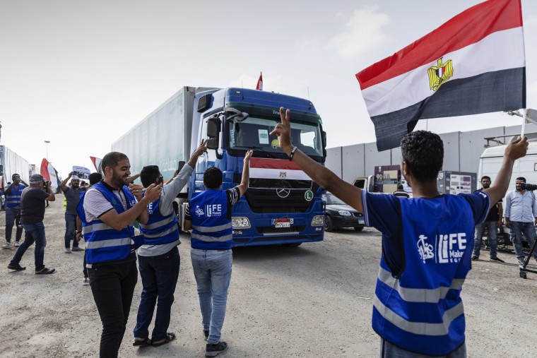 The second convoy of aid trucks cross the Rafah border from the Egyptian side on Oct. 22, 2023 in North Sinai, Egypt. 