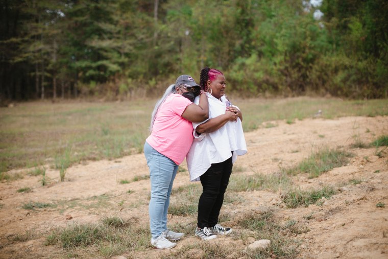 Image: Bettersten Wade is comforted by her sister.