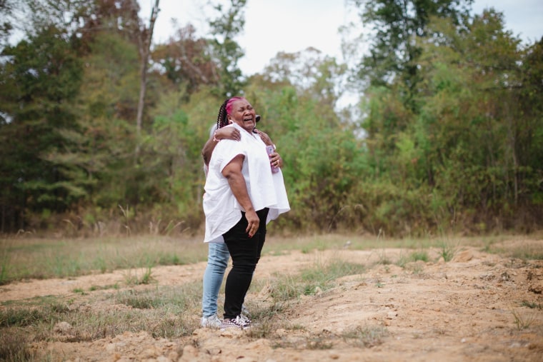 Image: Bettersten Wade is comforted by her sister.