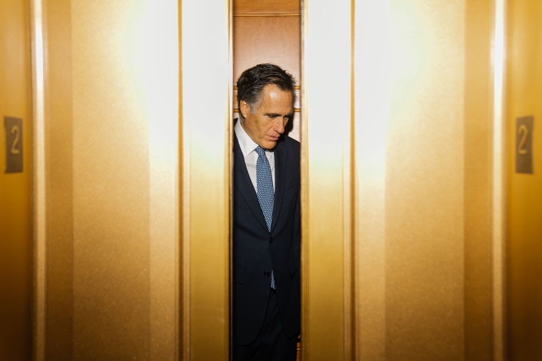 Sen. Mitt Romney, R-Utah, departs the Senate Chamber following a vote