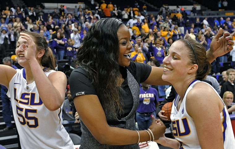 Image: Then-LSU assistant coach Tasha Butters, center, celebrates LSU's win over Kentucky in 2013.