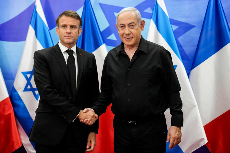 Israeli Prime Minister Benjamin Netanyahu greets French President Emmanuel Macron in Jerusalem.