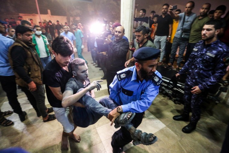 Injured people are brought into Nasser Medical Hospital in Khan Younis, Gaza.