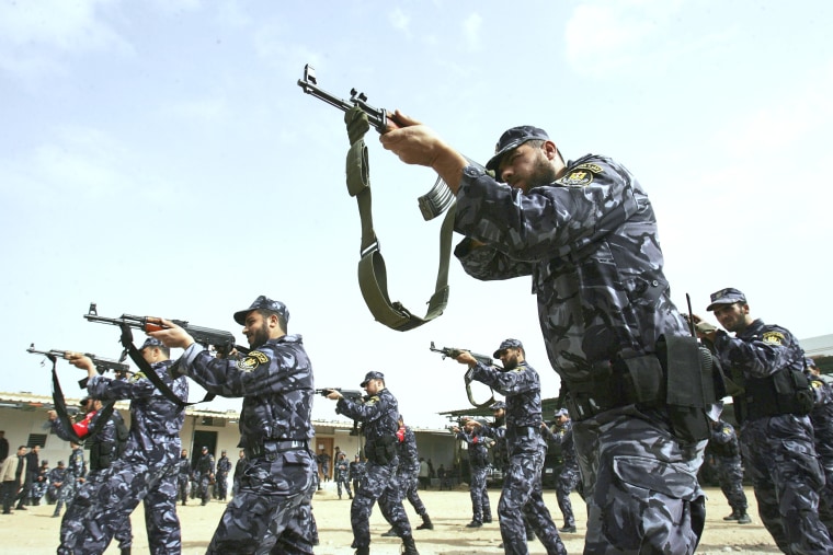 Members of the Hamas led-government executive security forces take part in an armed exercise