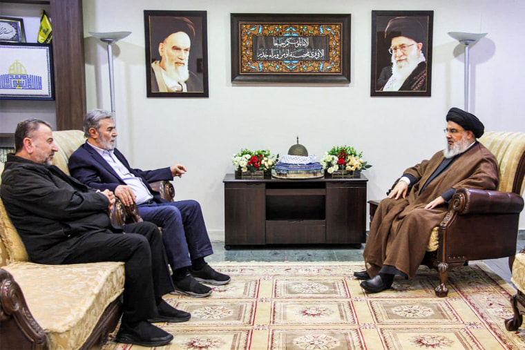 Hezbollah's secretary-general Hassan Nasrallah, right, meets with with the Palestinian secretary-general of the Islamic Jihad movement Ziad Nakhale, second left, and the Hamas's deputy chief of political affairs Saleh al-Arouri at an undisclosed location in Lebanon.