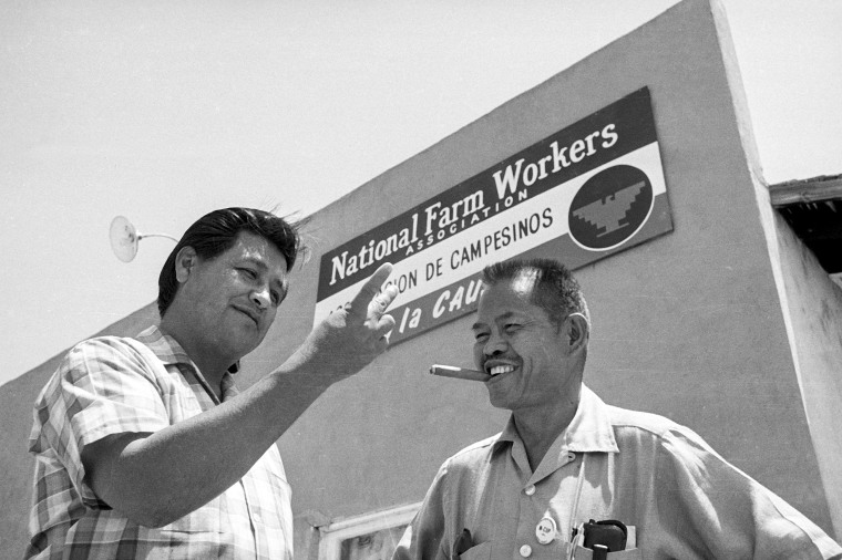 United Farm Workers leader Cesar Chavez, left, who led the fight as head of the AFL-CIO union local, talks Larry Itliong in Delano, Calif. on July 28, 1967.  