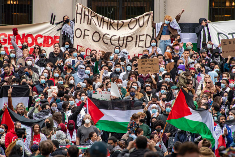 Protesters at Harvard University show their support for Palestinians in Gaza at a rally in Cambridge, Mass., on Oct. 14, 2023.