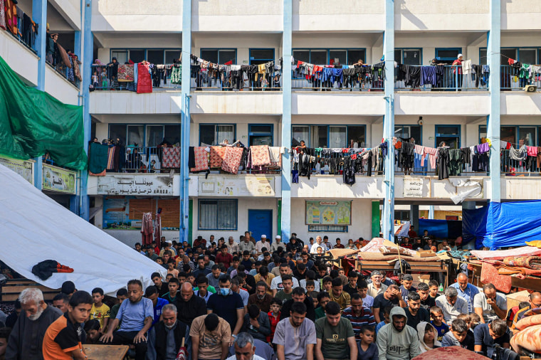 Internally displaced people gather for Friday prayer at UNRWA school in Khan Younis, Gaza.