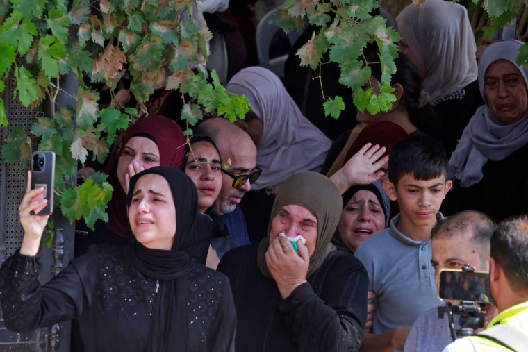 Mourners react during the funeral of 19-year-old Labib Damidi, who the Palestinian health ministry said shot by settlers, in the occupied West Bank town of Huwara on Oct. 6, 2023.